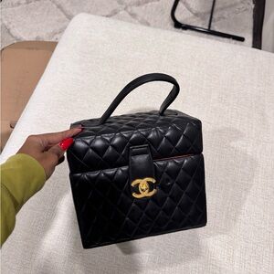 CHANEL Black Cosmetic Bag with Quilted Leather and Gold Hardware